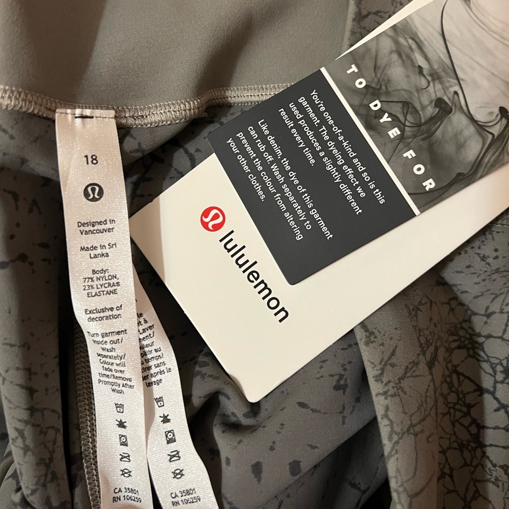 ( 2 ) lululemon leggings, 1 pair navy NWT HR 23 Invigorate. 1 pair NWT Tye Dye